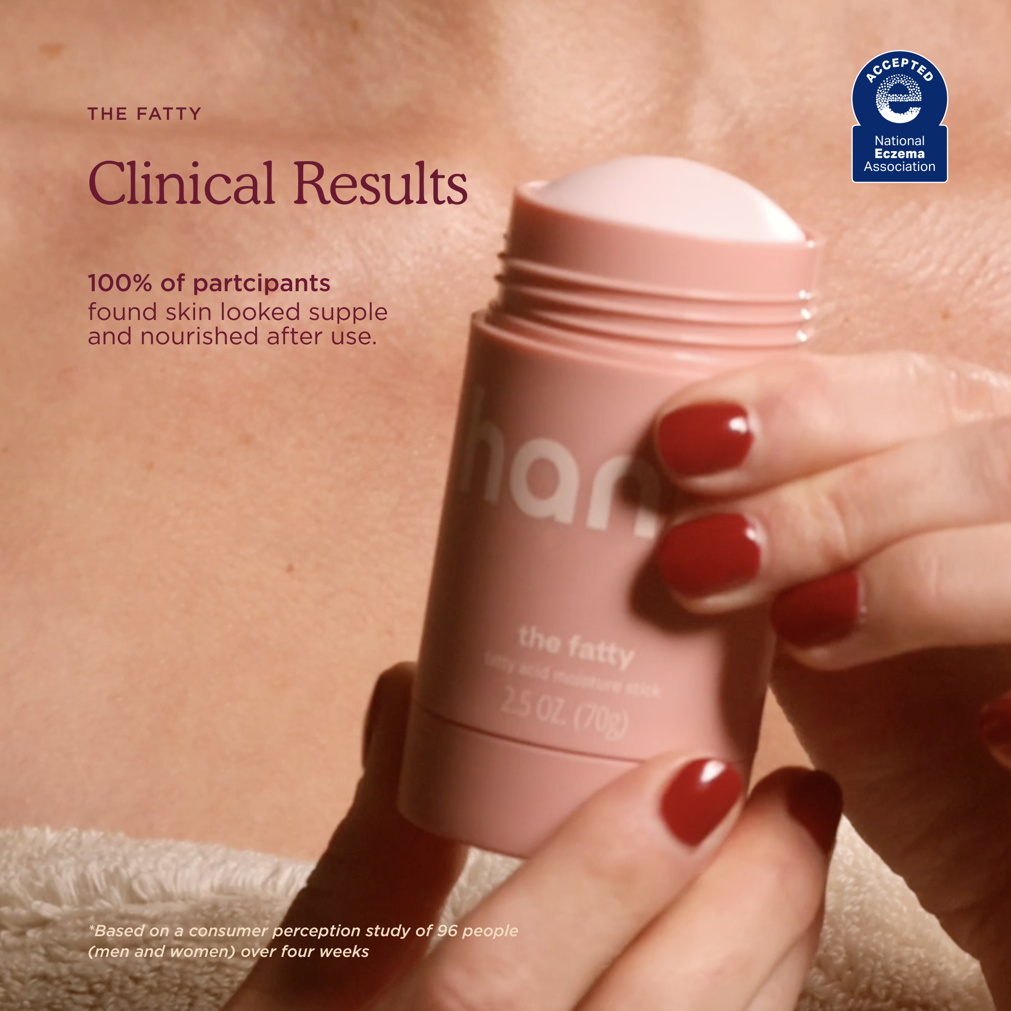 Pink skincare product held by a hand with red nail polish, against a skin-tone background.