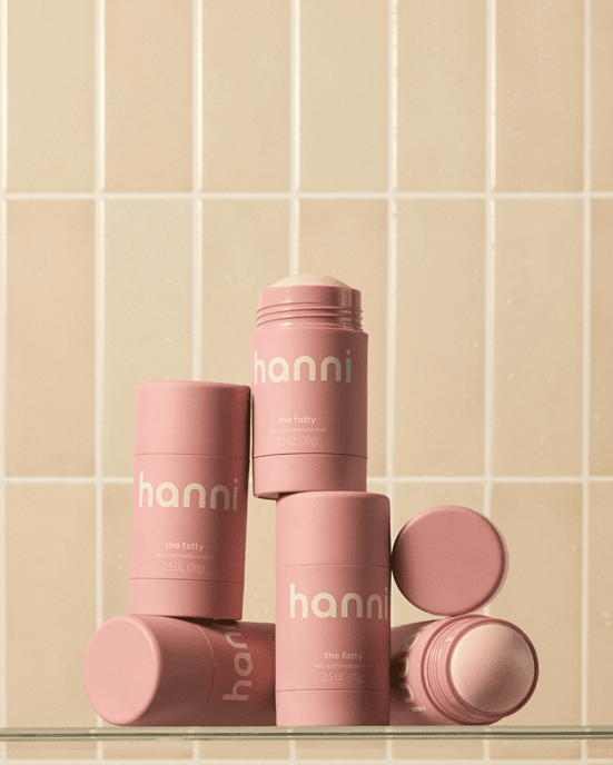 The Fatty moisturizer sticks on a bathroom shelf.